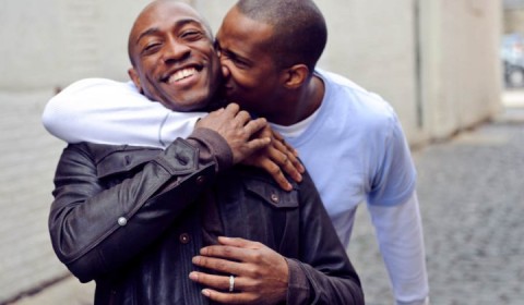 Two Black men in an embrace